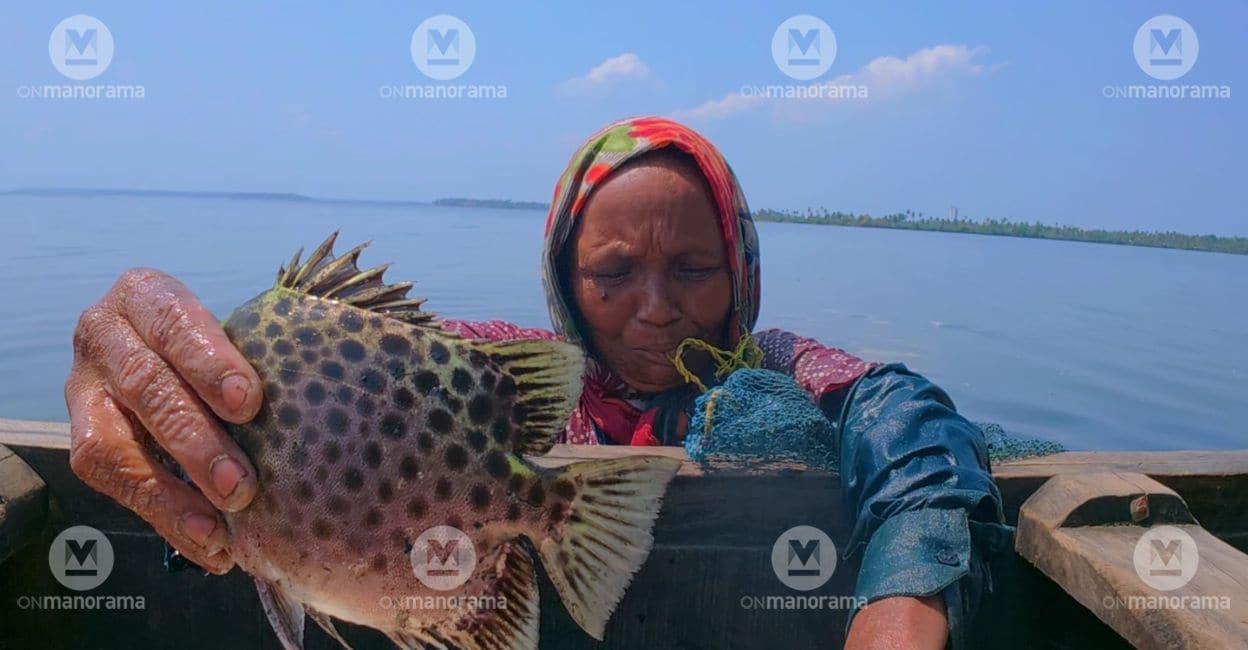 Ragini with the fish she caught from the backwaters. Photo: Onmanorama